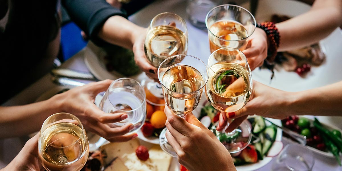 enjoying wine with dinner